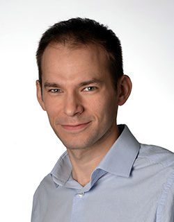 person stands in front of a white background